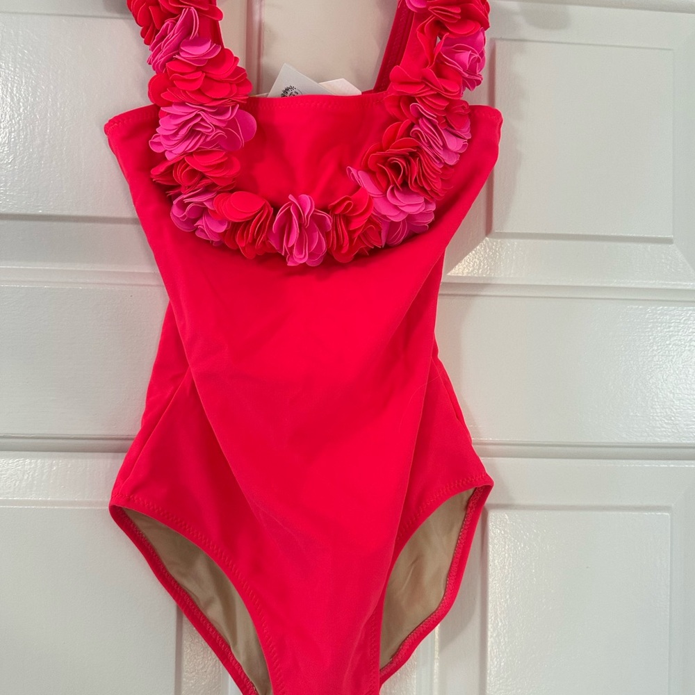 Vibrant Pink One-Piece Swimsuit with Floral Accents and skirt